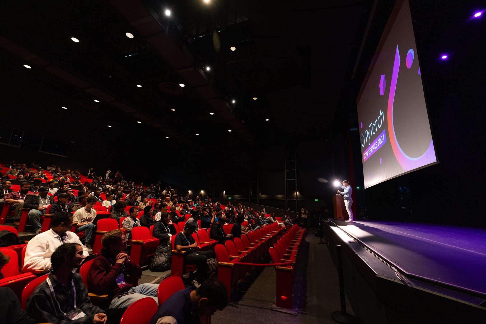 man speaking at a conference